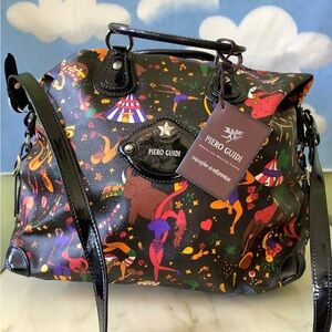 Magic Circus satchel/weekend bag. Leather and intricate design pattern.